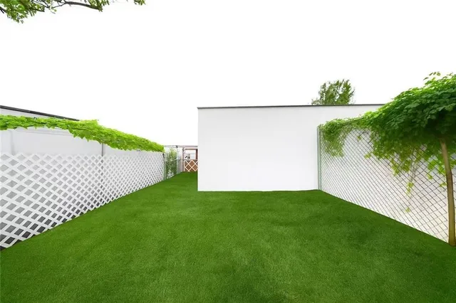 a view of a back yard of the house
