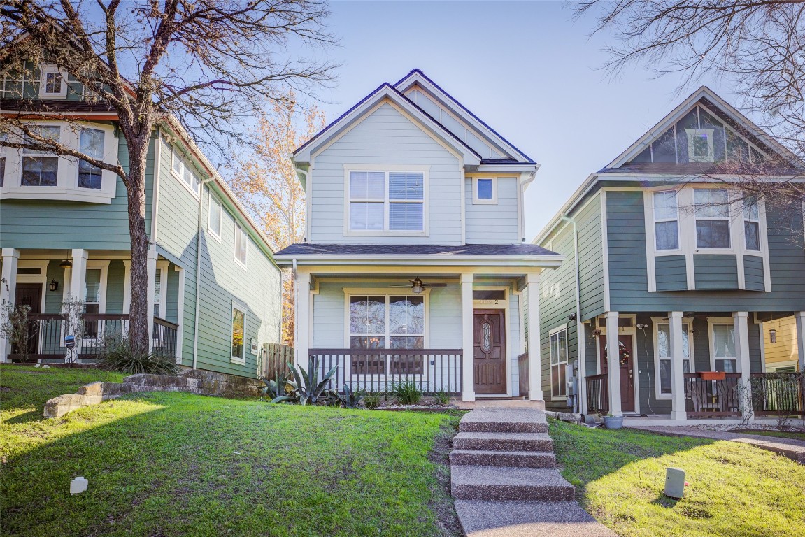 4109 East 12th Street, Unit 2 Austin, TX 78721 - Photo 1 of 39 a front view of brick house with a yard