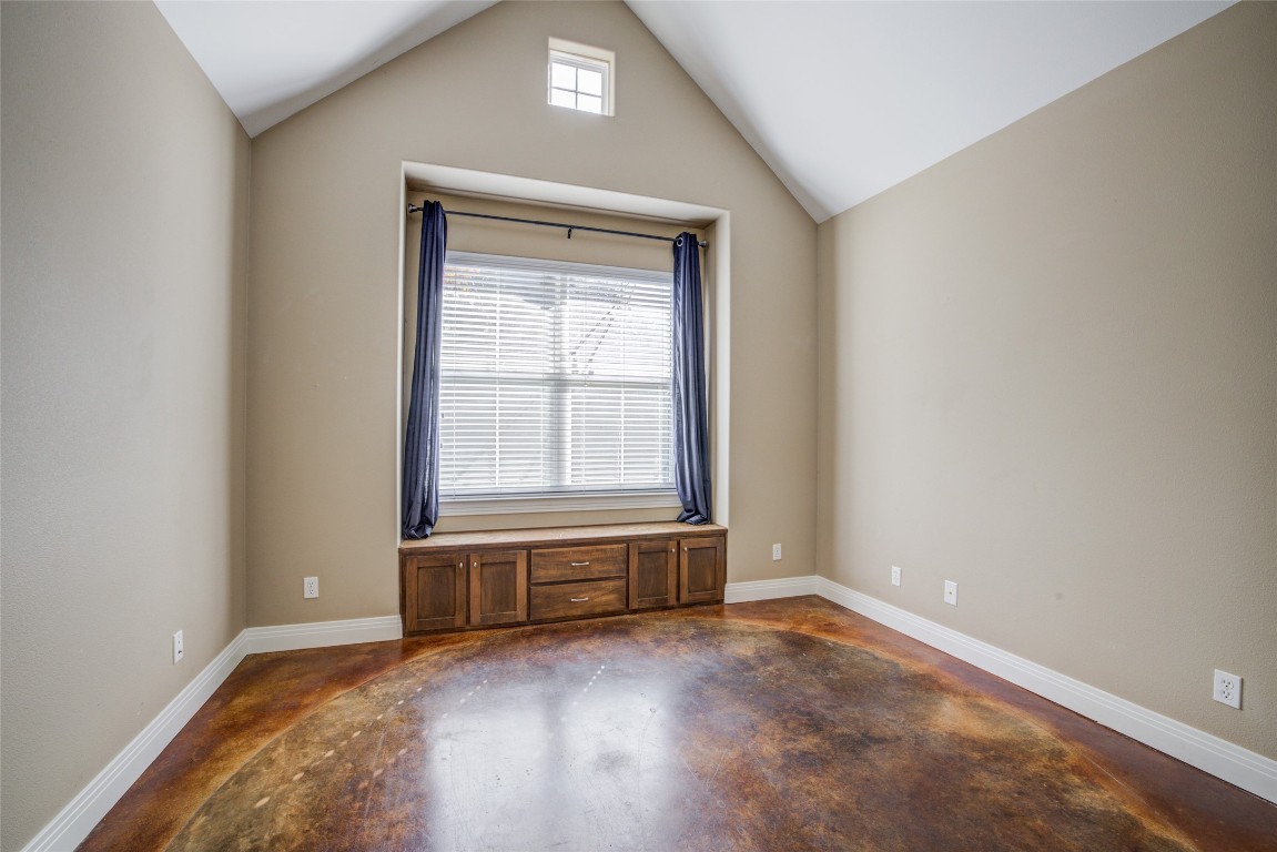 4109 East 12th Street, Unit 2 Austin, TX 78721 - Photo 14 of 39 an empty room with wooden floor and windows