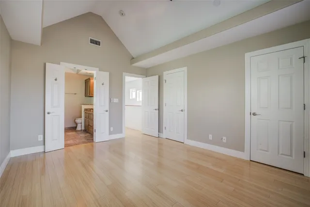 a bathroom with a granite countertop sink a toilet and bathtub