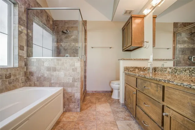 a bath tub sitting next to a shower