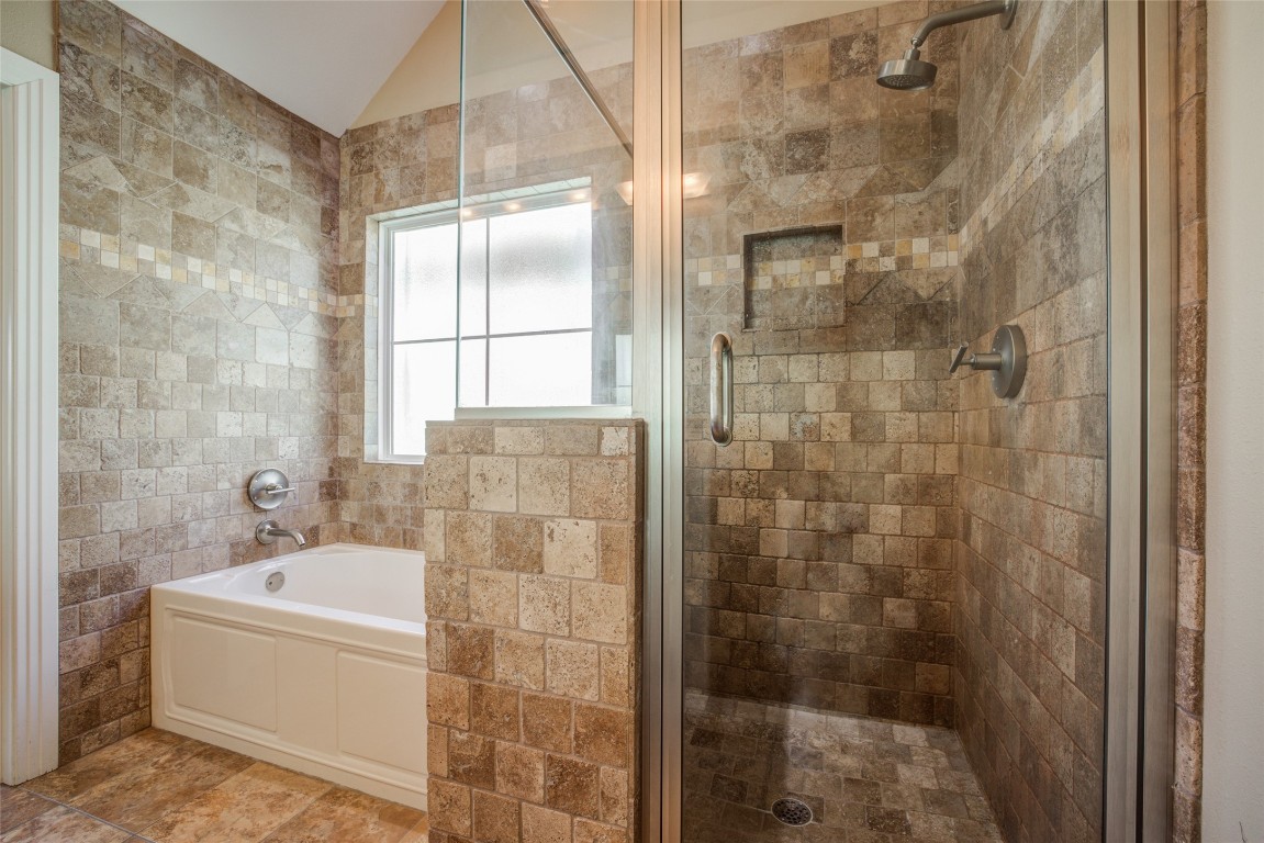4109 East 12th Street, Unit 2 Austin, TX 78721 - Photo 24 of 39 a bathroom with a bathtub and shower