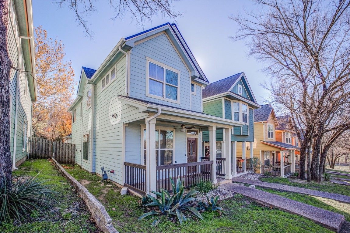 4109 East 12th Street, Unit 2 Austin, TX 78721 - Photo 3 of 39 a front view of a house with a garden