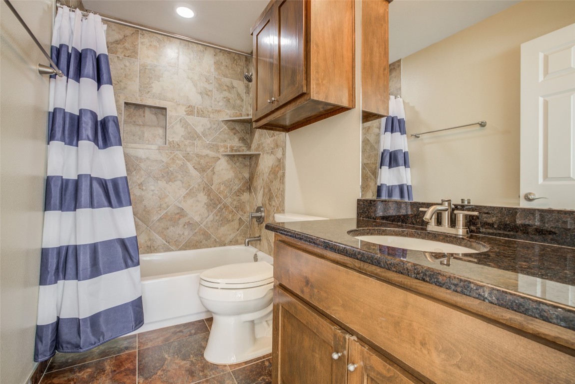 4109 East 12th Street, Unit 2 Austin, TX 78721 - Photo 32 of 39 a bathroom with a sink and a mirror