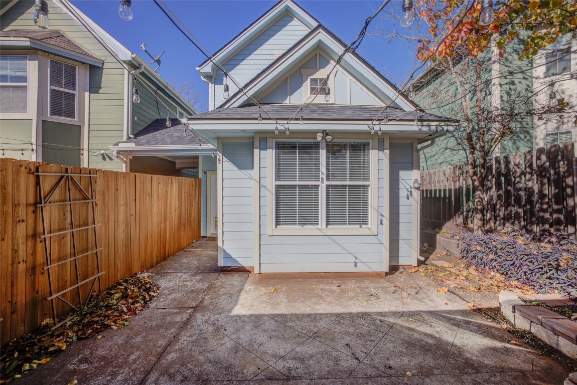 4109 East 12th Street, Unit 2 Austin, TX 78721 - Photo 34 of 39 a front view of a house with a yard and garage