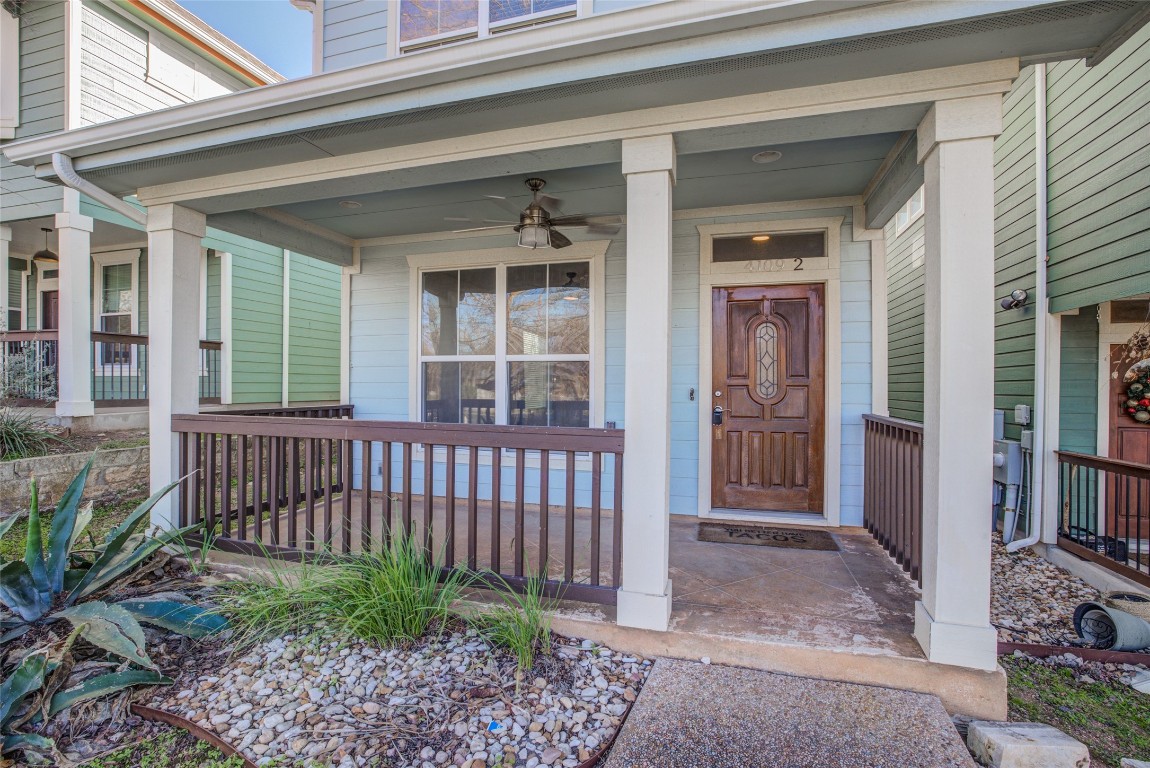 4109 East 12th Street, Unit 2 Austin, TX 78721 - Photo 4 of 39 a view of a house with a small yard and wooden floor and fence
