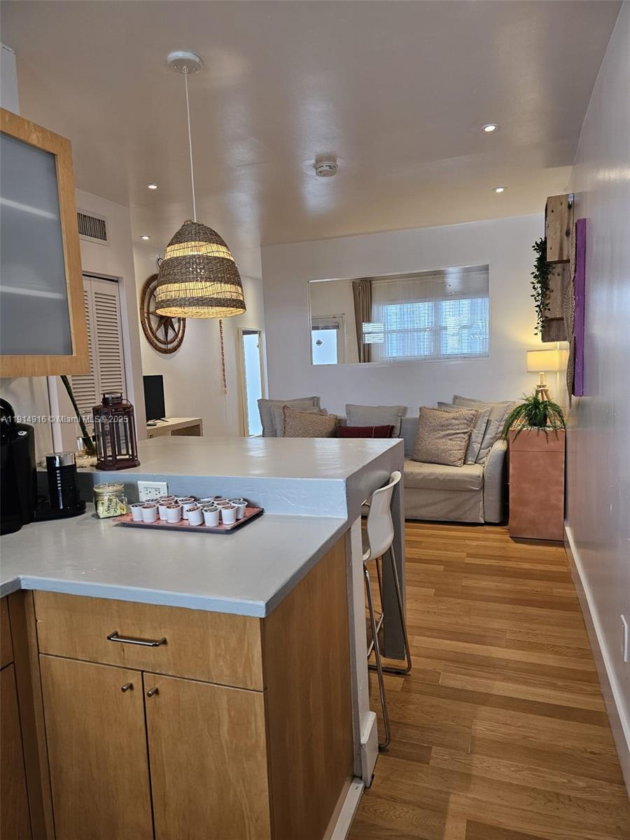 751 Collins Avenue, Unit 2 Miami Beach, FL 33139 - Photo 16 of 25 a open kitchen with stainless steel appliances granite countertop a stove and a sink