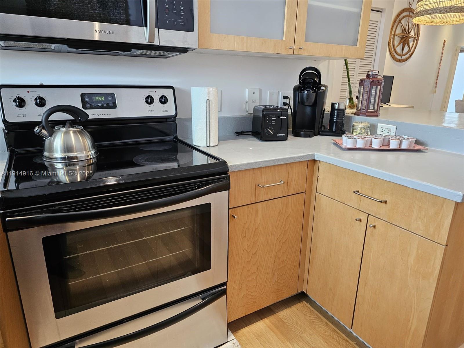 751 Collins Avenue, Unit 2 Miami Beach, FL 33139 - Photo 18 of 25 a white stove top oven sitting inside of a kitchen