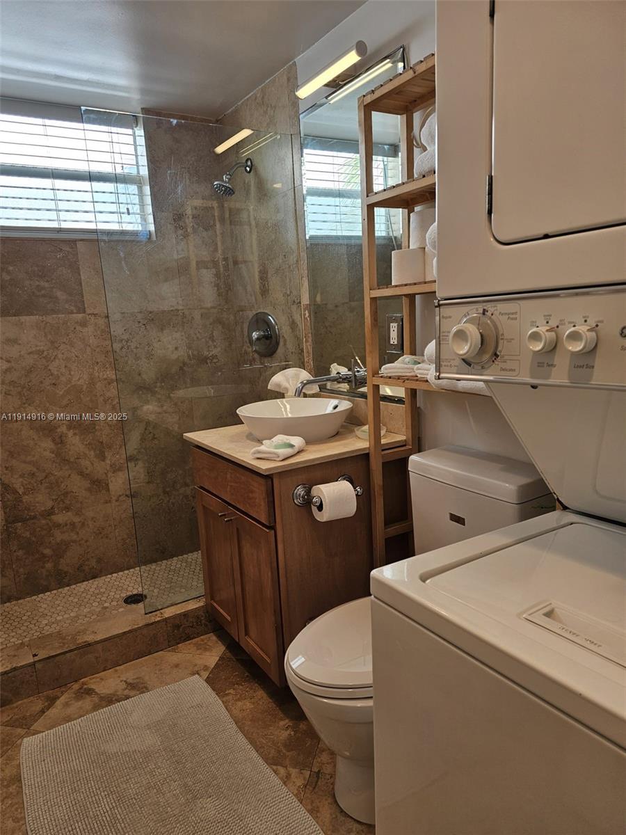 751 Collins Avenue, Unit 2 Miami Beach, FL 33139 - Photo 25 of 25 a bathroom with a sink a toilet and shower