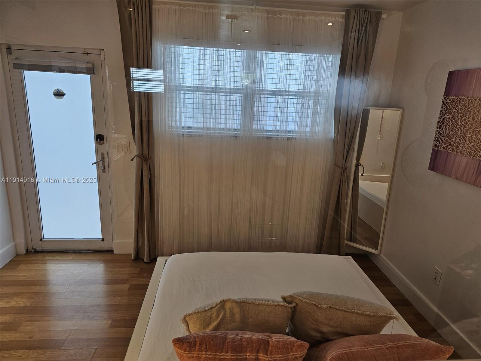 751 Collins Avenue, Unit 2 Miami Beach, FL 33139 - Photo 3 of 25 a living room with furniture and a window