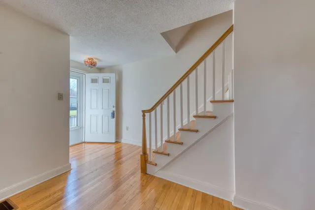 a view of entryway with wooden floor