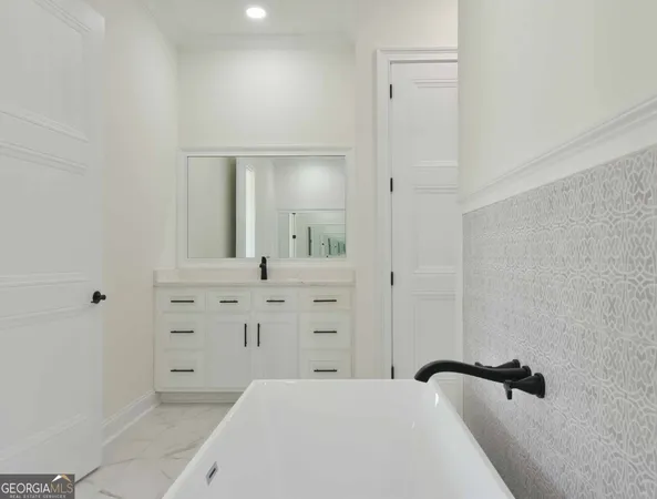 a bathroom with a bathtub and shower