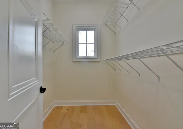 a bathroom with a tub and window