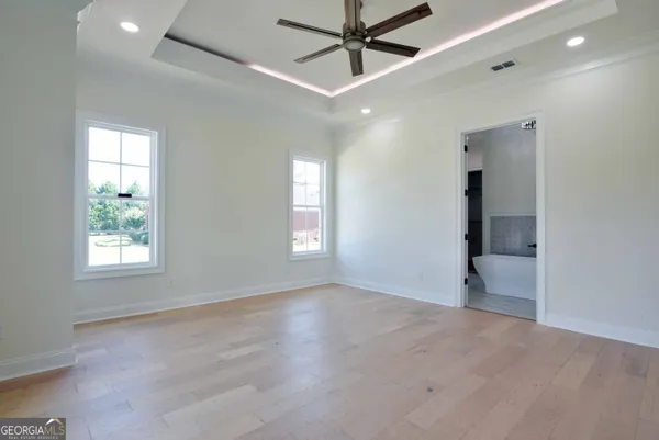 a view of an empty room with a window