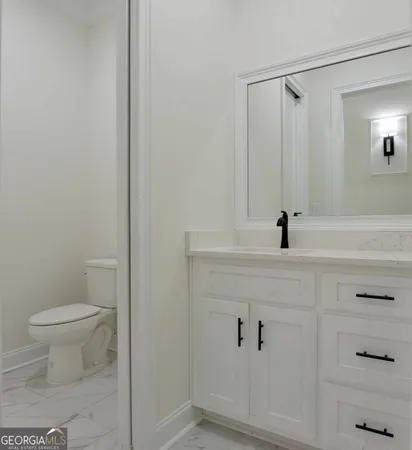 a bathroom with a sink and a toilet