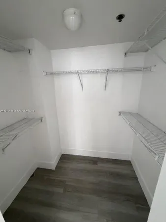 a view of an empty walk in closet