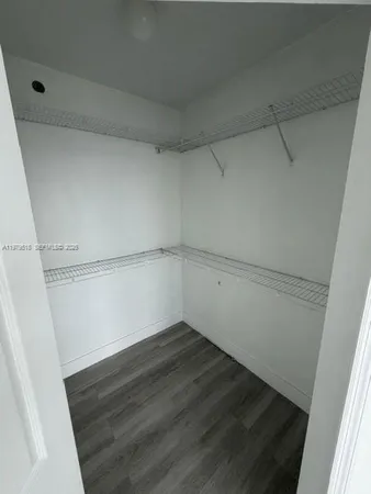 a view of an empty walk in closet