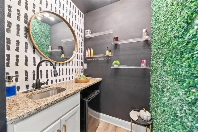 view of a kitchen with a sink and cabinets