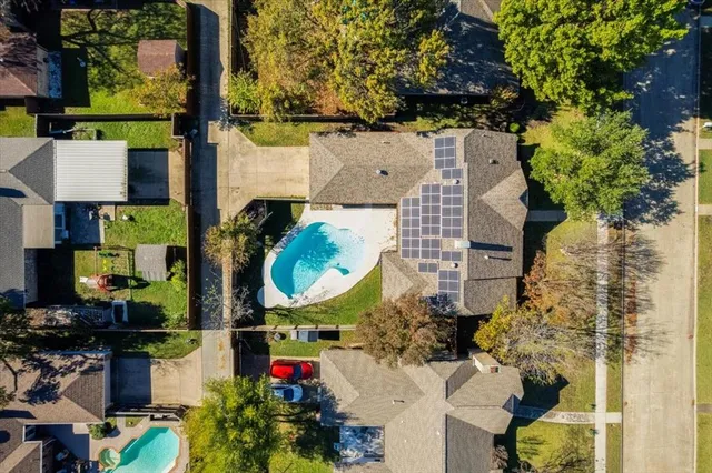 an aerial view of houses with outdoor space