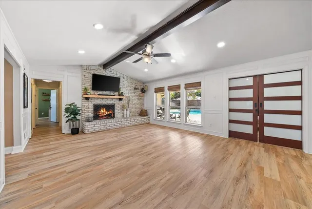 a view of a livingroom with furniture and a fireplace