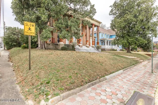 a view of a street with houses