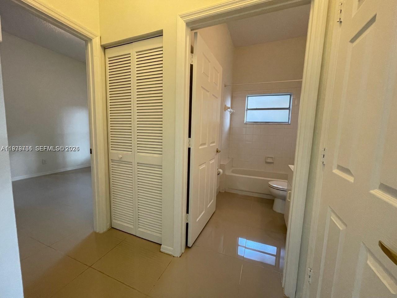 16309 Emerald Cove Road, Unit 16309 Weston, FL 33331 - Photo 16 of 41 a bathroom with a tub