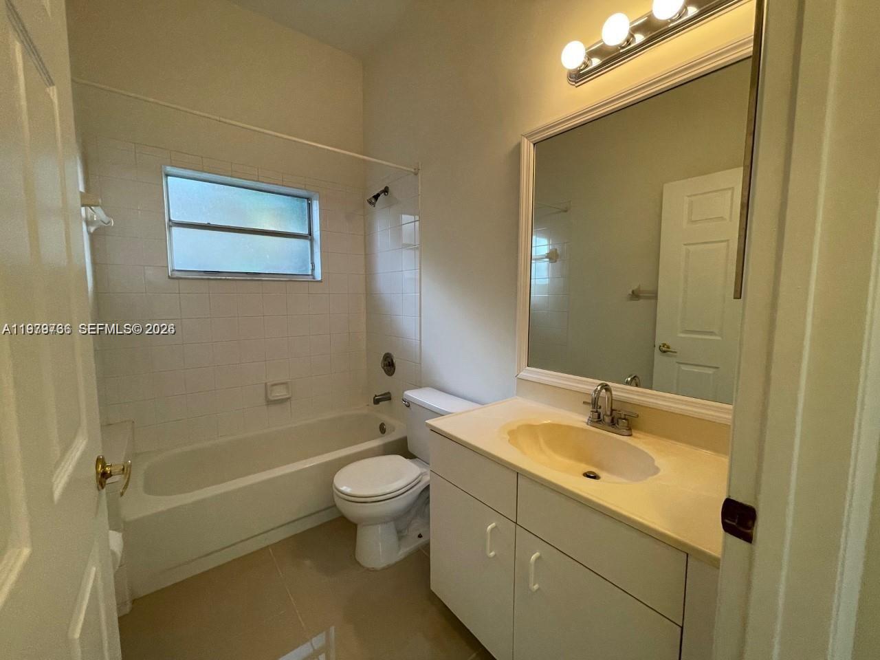16309 Emerald Cove Road, Unit 16309 Weston, FL 33331 - Photo 17 of 41 a bathroom with a sink and a mirror
