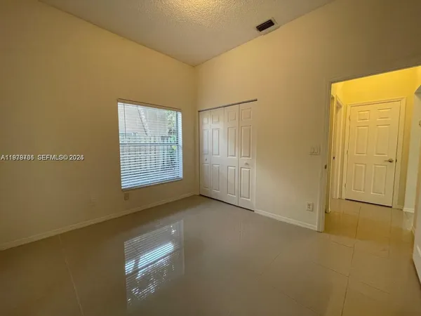 a view of an empty room with windows