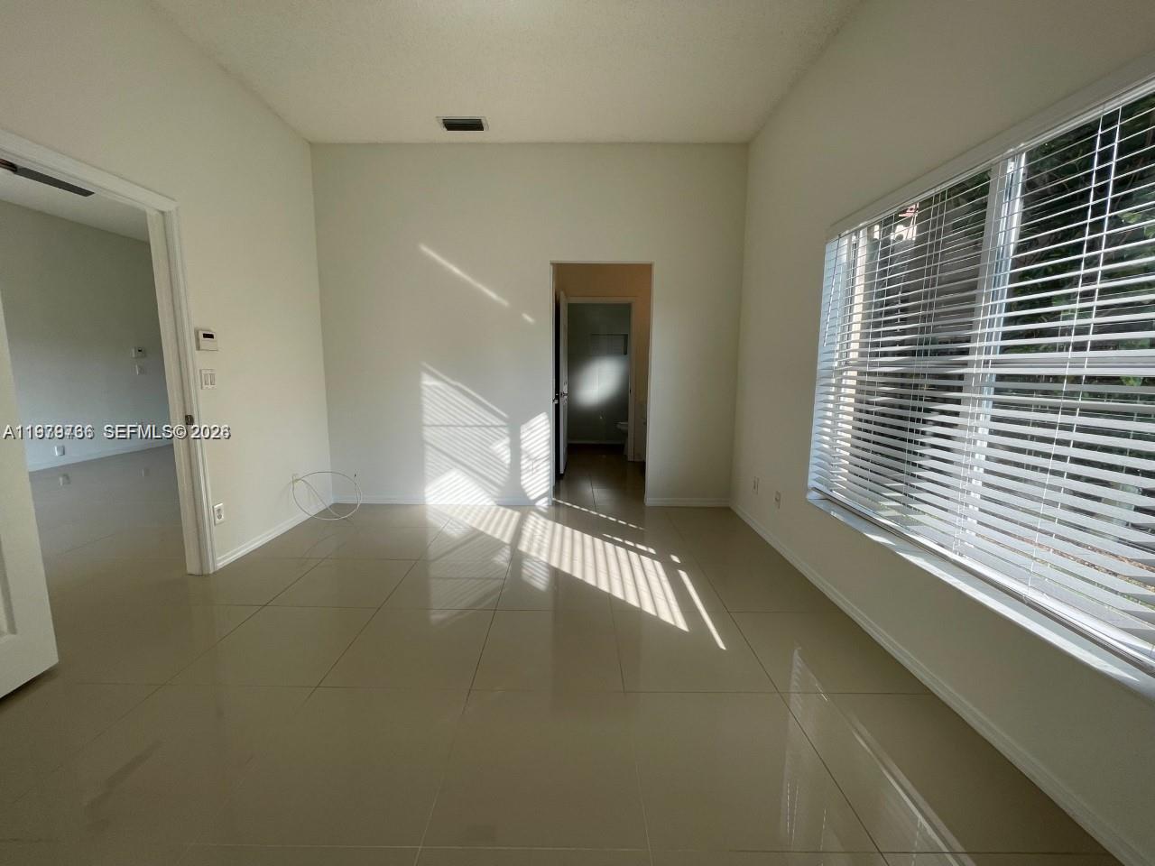 16309 Emerald Cove Road, Unit 16309 Weston, FL 33331 - Photo 23 of 41 a view of a room with a large window