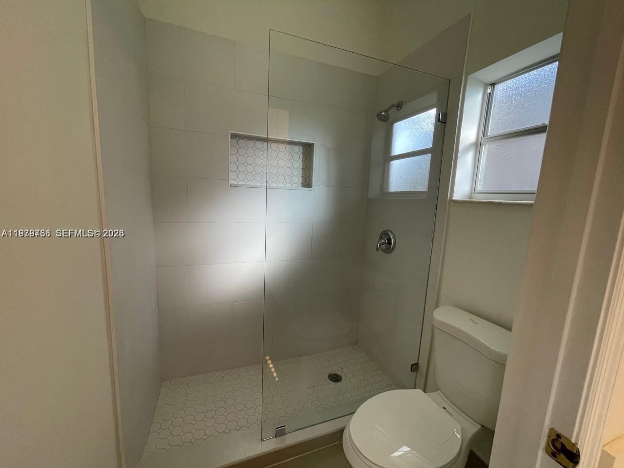 16309 Emerald Cove Road, Unit 16309 Weston, FL 33331 - Photo 27 of 41 a bathroom with a toilet and a shower