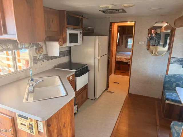 a view of an empty room and wooden floor