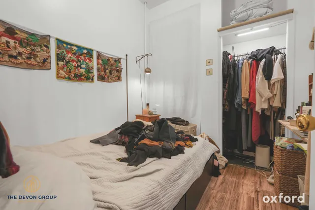 a bed room with a bed and a walk in closet