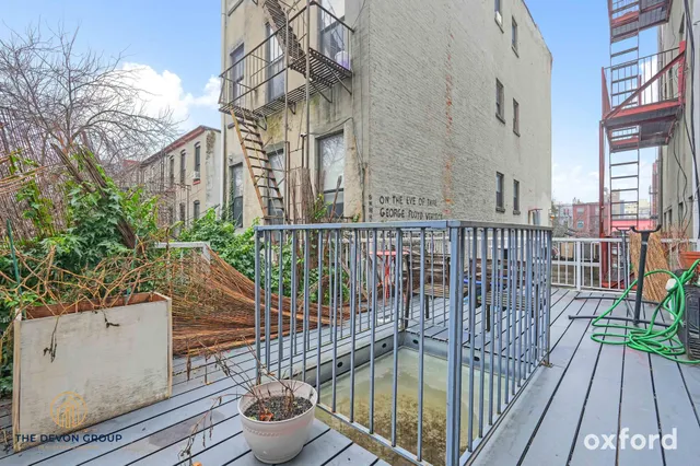 a view of a balcony with potted plants