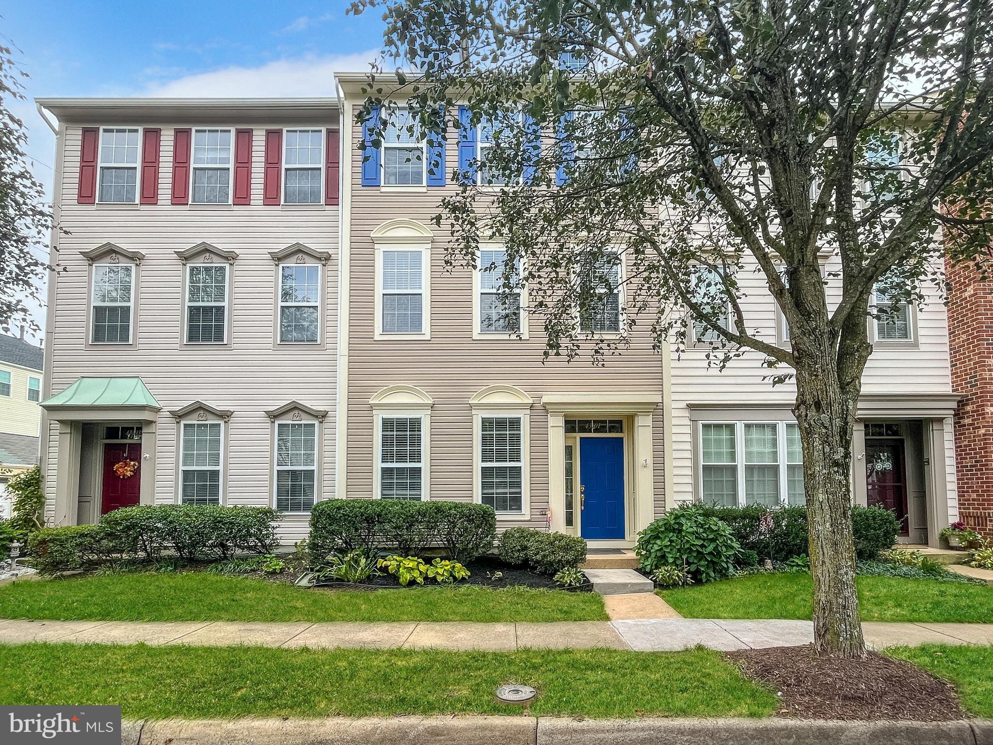 43101 Demerrit Street Chantilly, VA 20152 - Photo 1 of 55 front view of a brick house with a yard