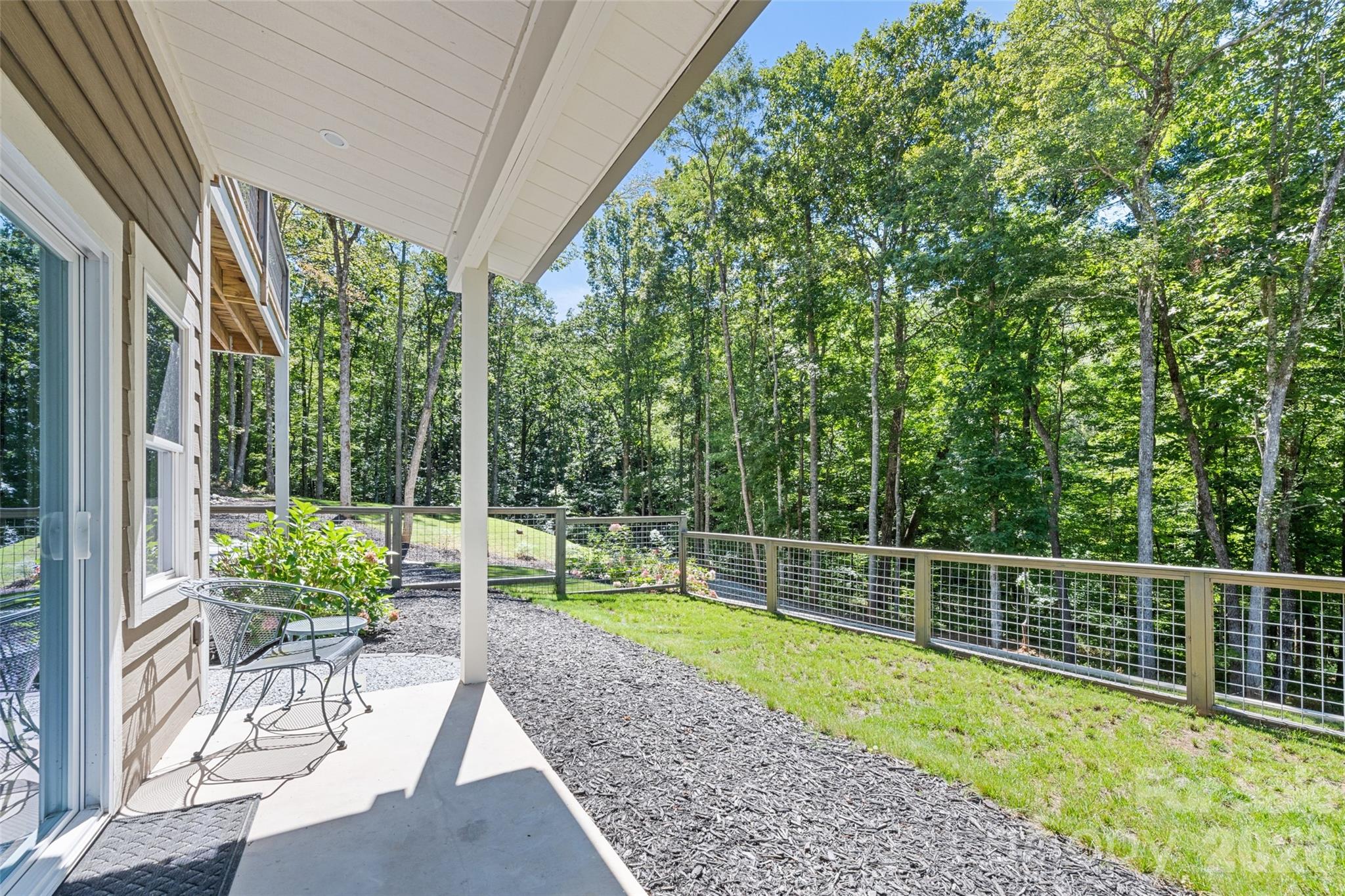 1185 Wallalieu Road Otto, NC 28763 - Photo 36 of 43 a view of a chair and tables in the backyard