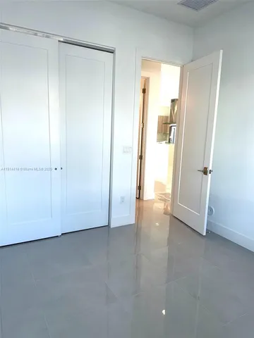 a bathroom with a toilet and a bath tub