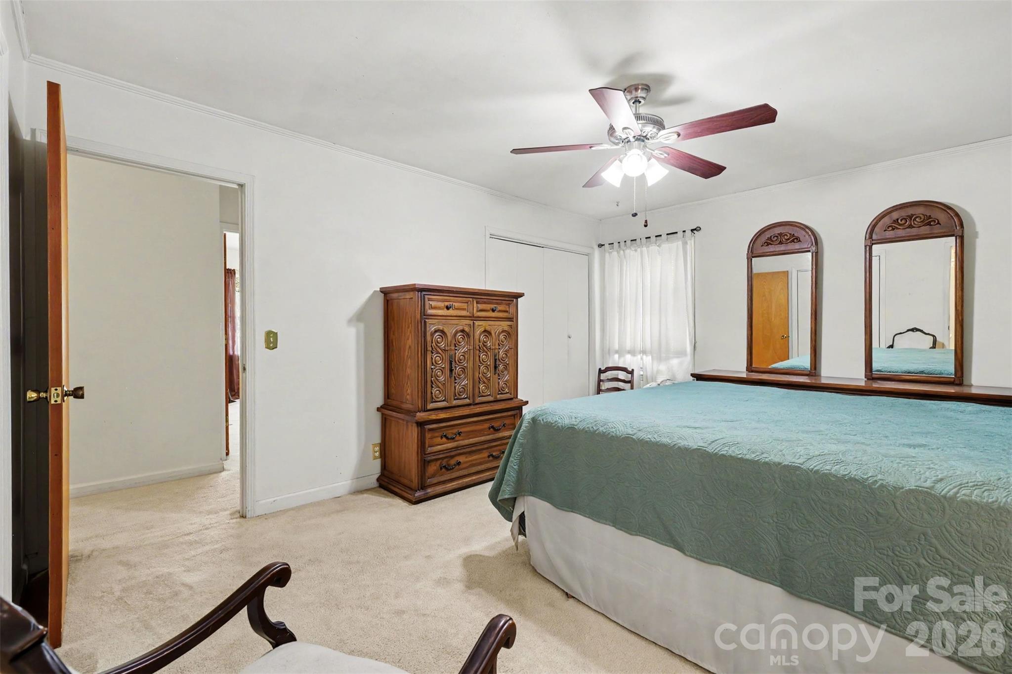 6774 Woodhaven Road Kershaw, SC 29067 - Photo 21 of 30 a bedroom with a bed and a chandelier