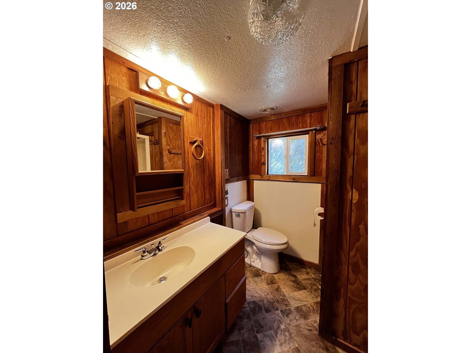 85141 Cedar Drive Florence, OR 97439 - Photo 21 of 37 a bathroom with a sink a toilet and shower
