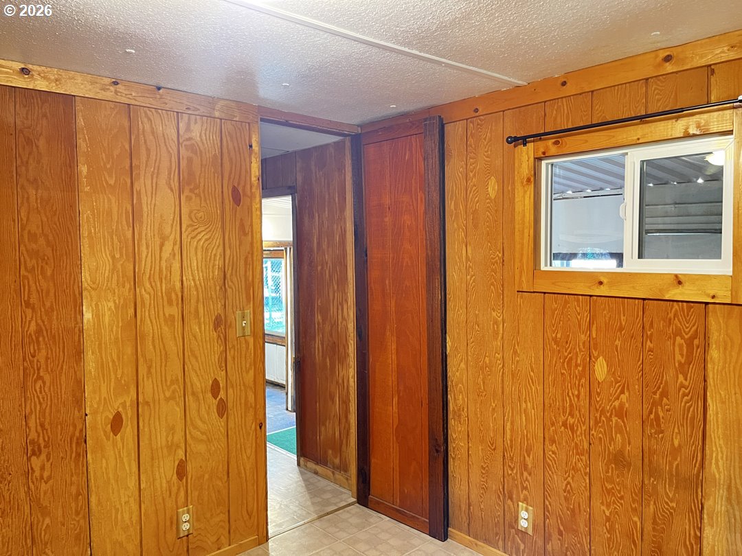 85141 Cedar Drive Florence, OR 97439 - Photo 25 of 37 a view of a door and wooden walls