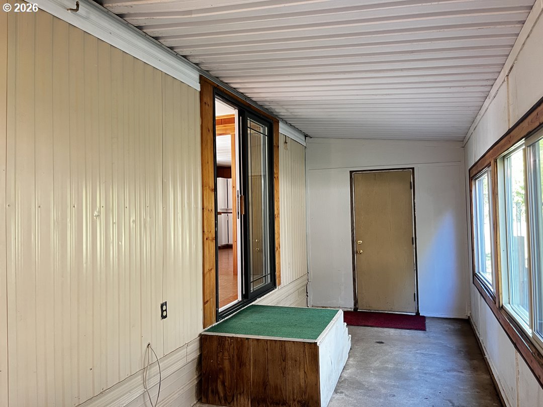 85141 Cedar Drive Florence, OR 97439 - Photo 29 of 37 a big room with wooden floor and windows