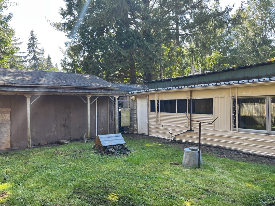 85141 Cedar Drive Florence, OR 97439 - Photo 6 of 37 a house view with a garden space
