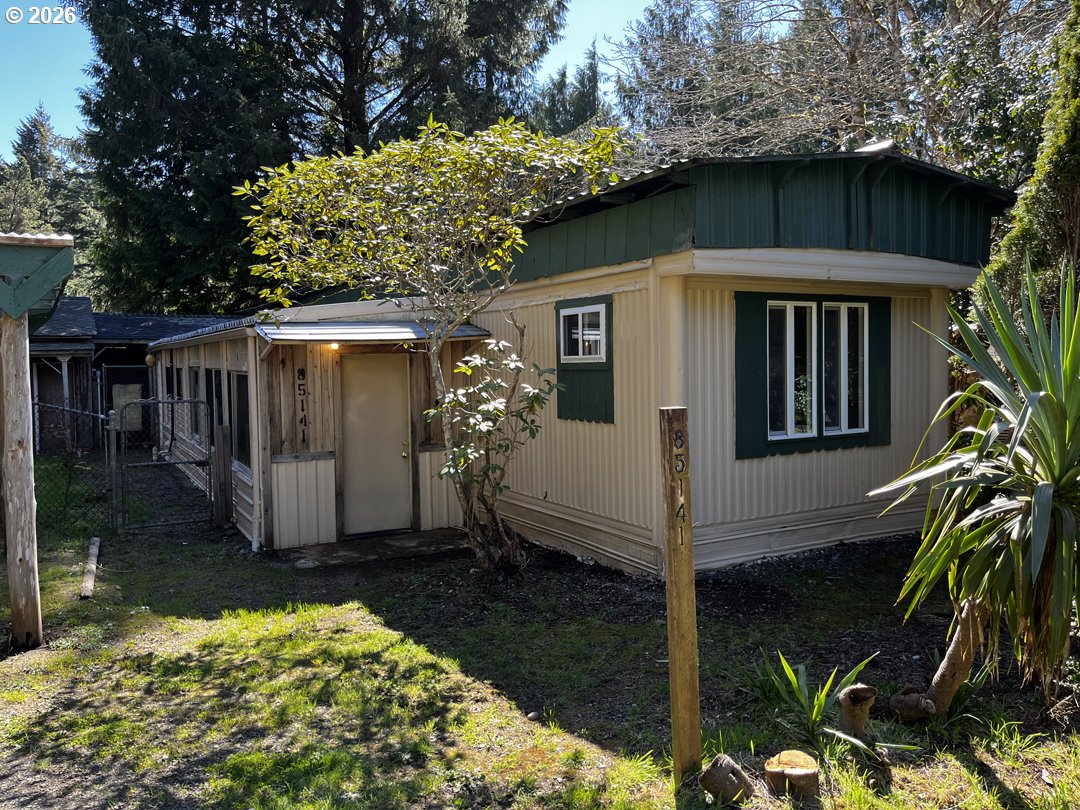 85141 Cedar Drive Florence, OR 97439 - Photo 9 of 37 a view of a house with a yard