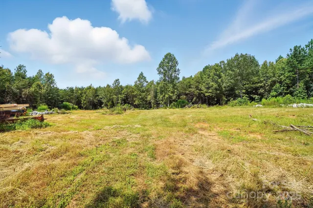 a view of outdoor space with deck and yard