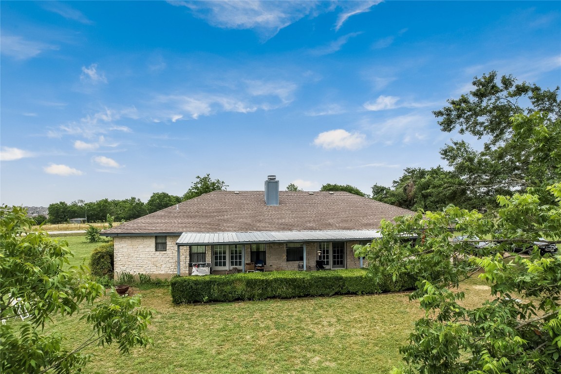 1931 Rowe Loop Pflugerville, TX 78660 - Photo 11 of 37 a view of house in front of a big yard with potted plants