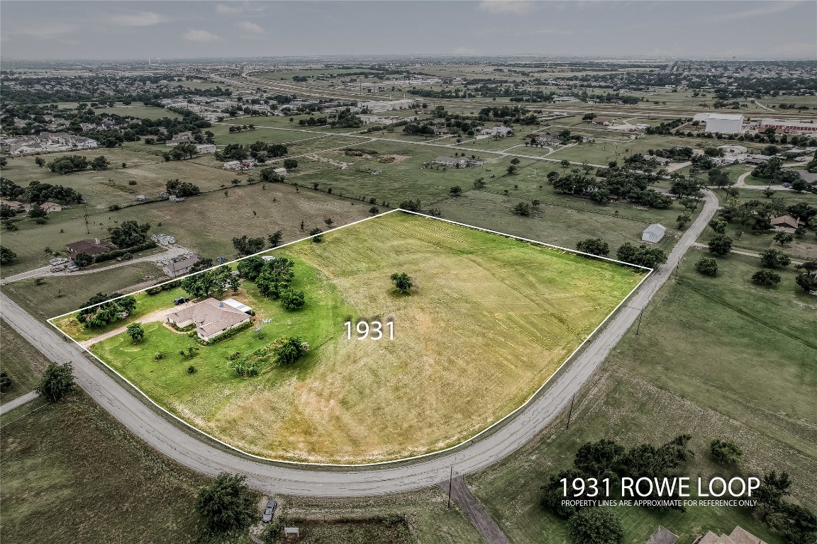 1931 Rowe Loop Pflugerville, TX 78660 - Photo 2 of 37 an aerial view of a swimming pool