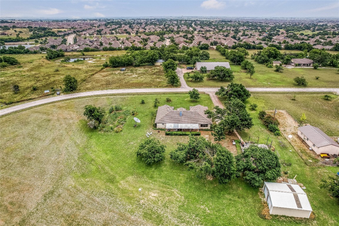 1931 Rowe Loop Pflugerville, TX 78660 - Photo 23 of 37 an aerial view of residential houses with outdoor space