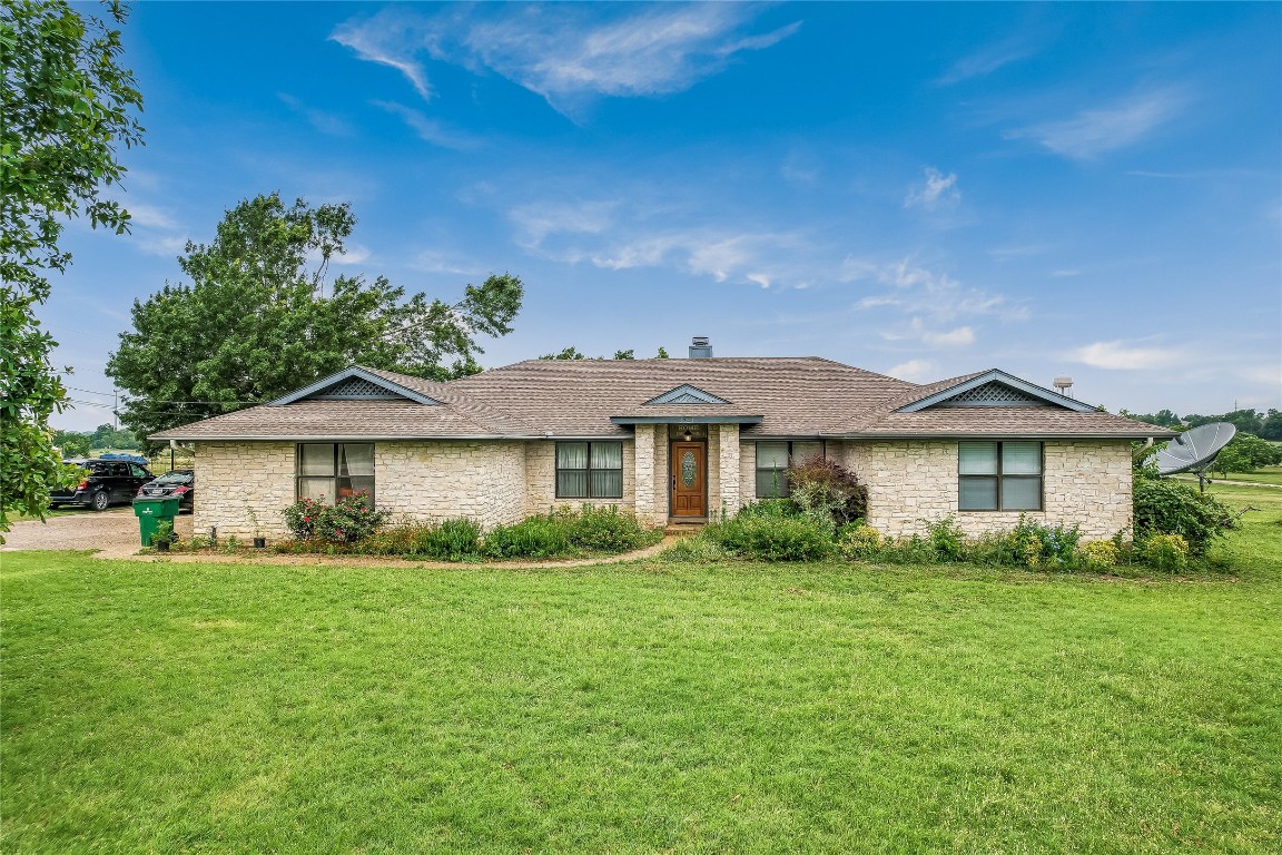 1931 Rowe Loop Pflugerville, TX 78660 - Photo 29 of 37 a view of a house with a big yard and potted plants