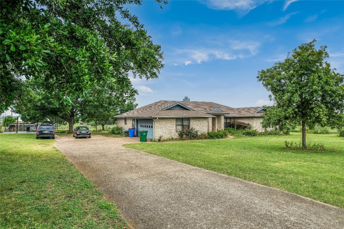 1931 Rowe Loop Pflugerville, TX 78660 - Photo 31 of 37 a view of a house with a yard