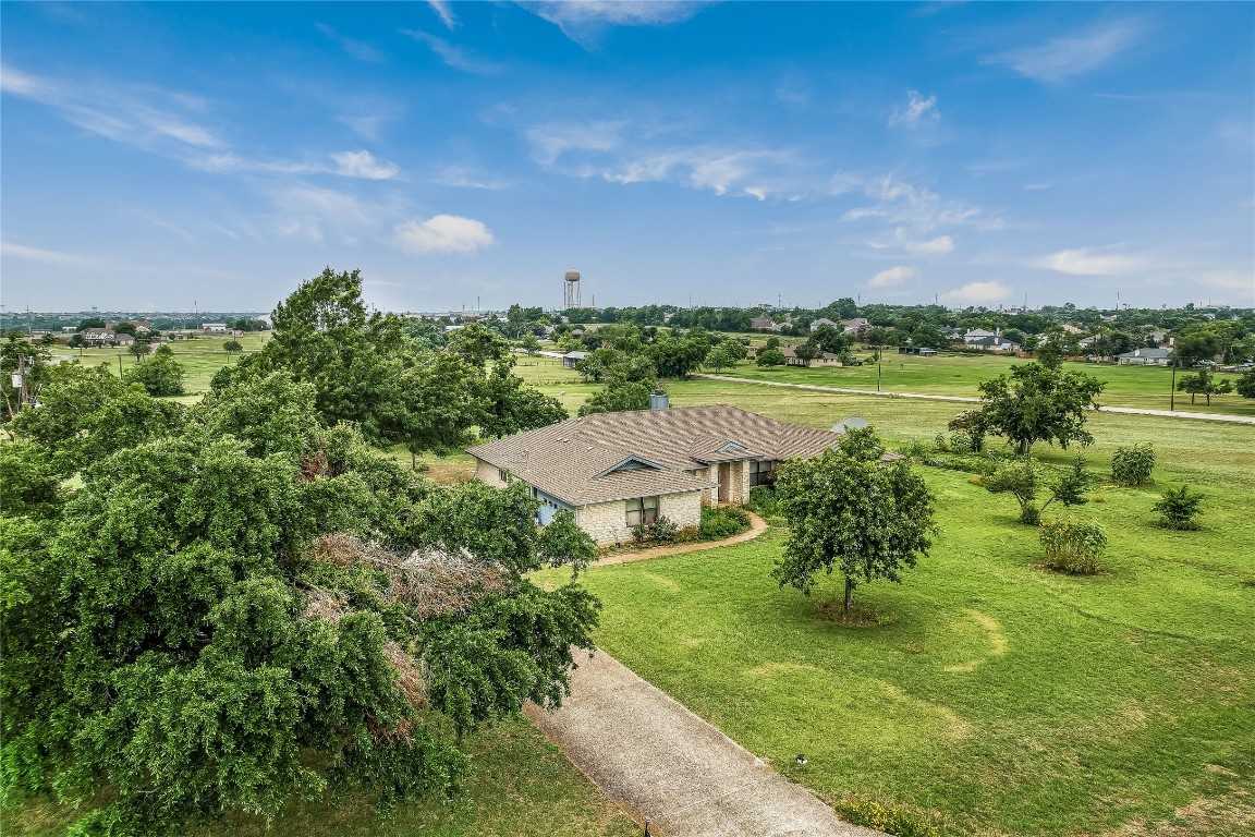 1931 Rowe Loop Pflugerville, TX 78660 - Photo 6 of 37 a view of a lake with a yard
