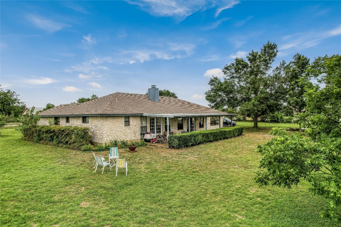 1931 Rowe Loop Pflugerville, TX 78660 - Photo 10 of 37 a front view of a house with garden